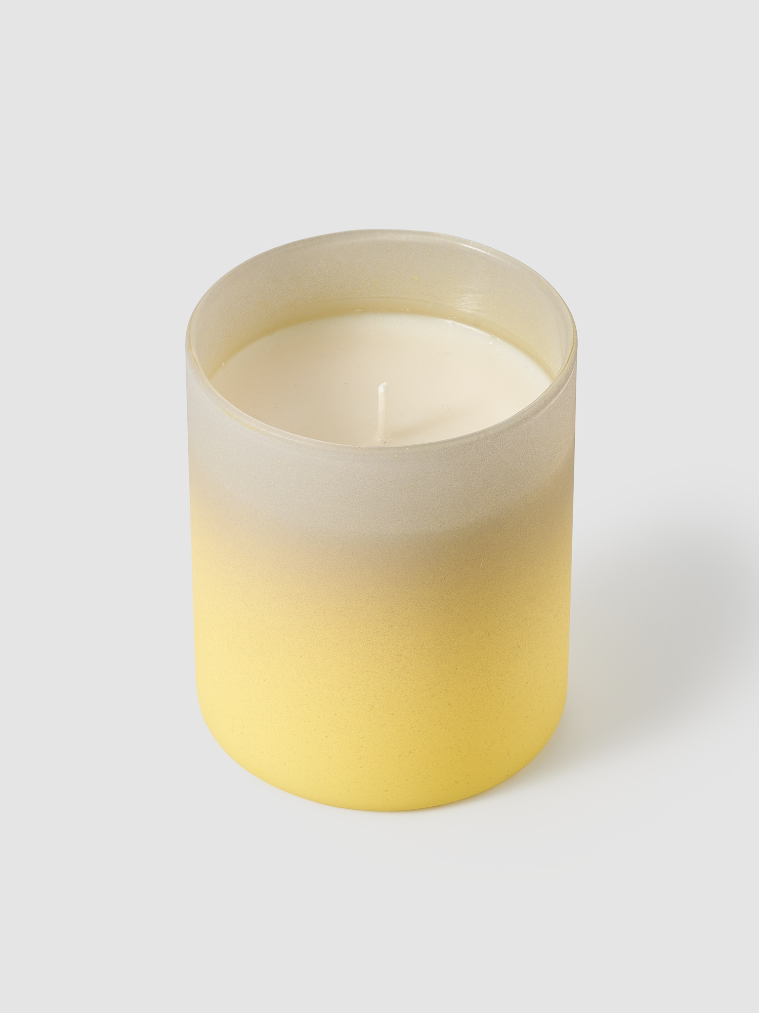 Свеча в стакане с желто-серым градиентом 